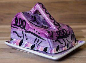 Abstract cheese dish in purple