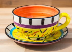 Splash cup and saucer in Yellow