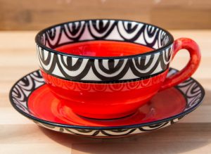 Aztec cup and saucer in red