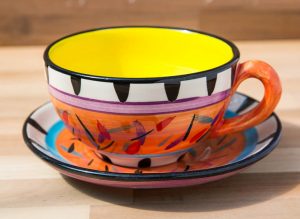 Splash cup and saucer in Orange