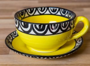 Aztec cup and saucer in yellow