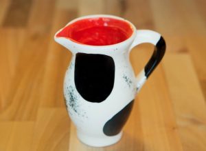 Black and white creamer jug in spot