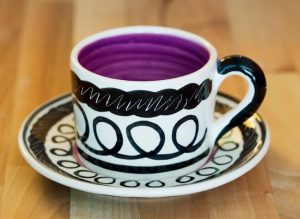 Black and white small cup and saucer in scribble