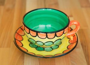 Fruity cup and saucer in orange