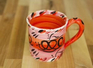 Abstract wide parallel mug in red