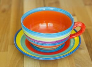 horizontal stripey cup and saucer in candy