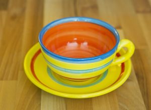 horizontal stripey cup and saucer in yellow