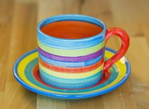 Horizontal stripey small cup and saucer in candy