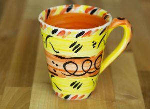 Abstract small tapered mug in yellow