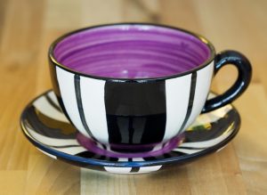 Black and white cup and saucer in broad stripe